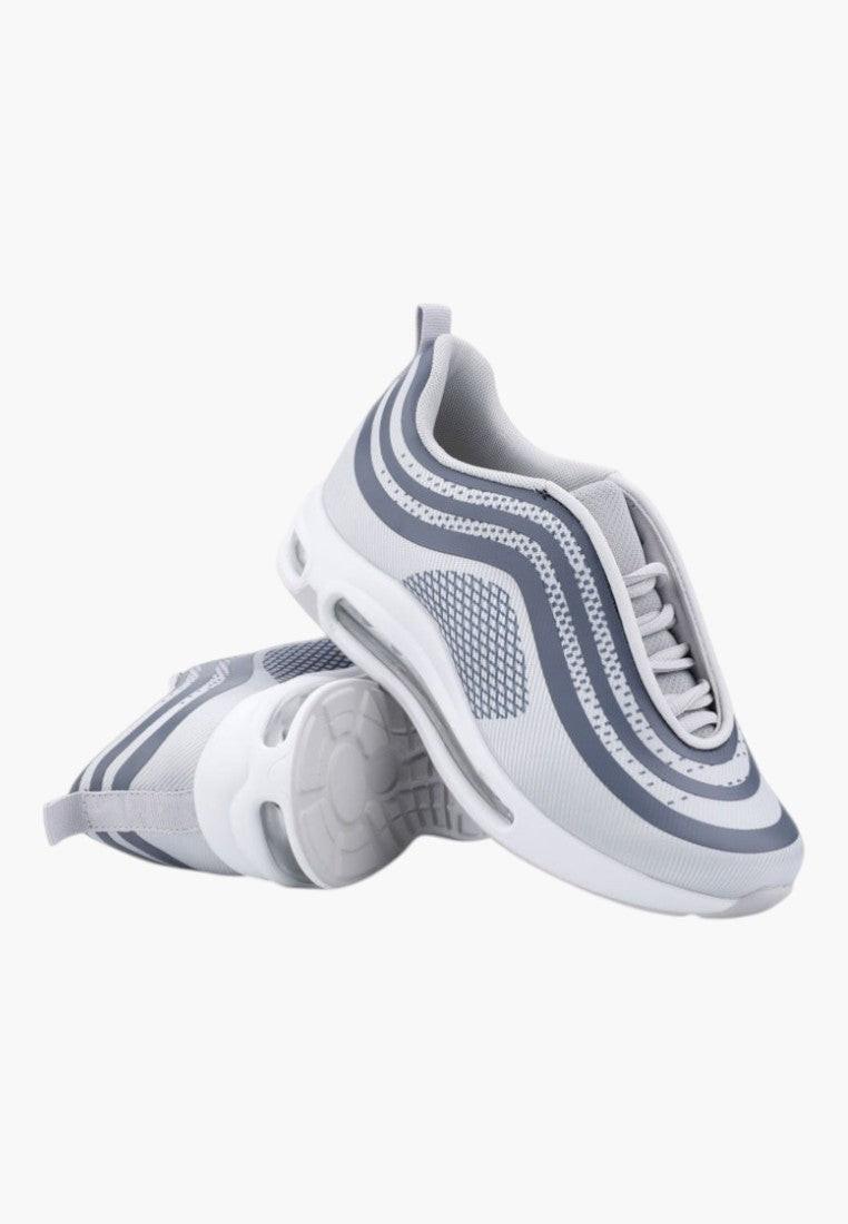 Ciemno szare buty sportowe damskie z boku, z grubą podeszwą na białym tle.
