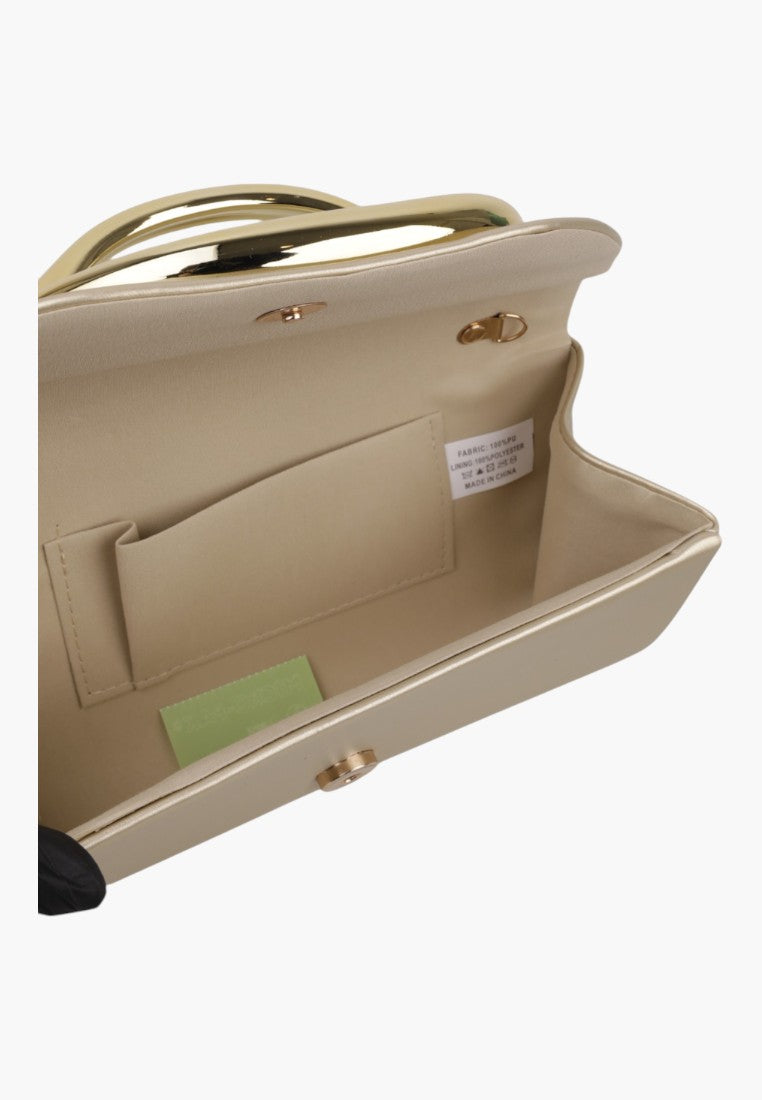 Detail of the interior of the clutch bag featuring an inner pocket and gold hardware.