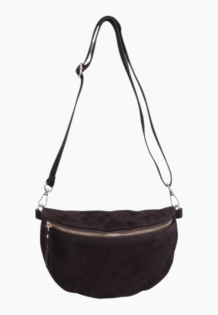 Side view of the black suede handbag featuring an adjustable strap and zipper closure.