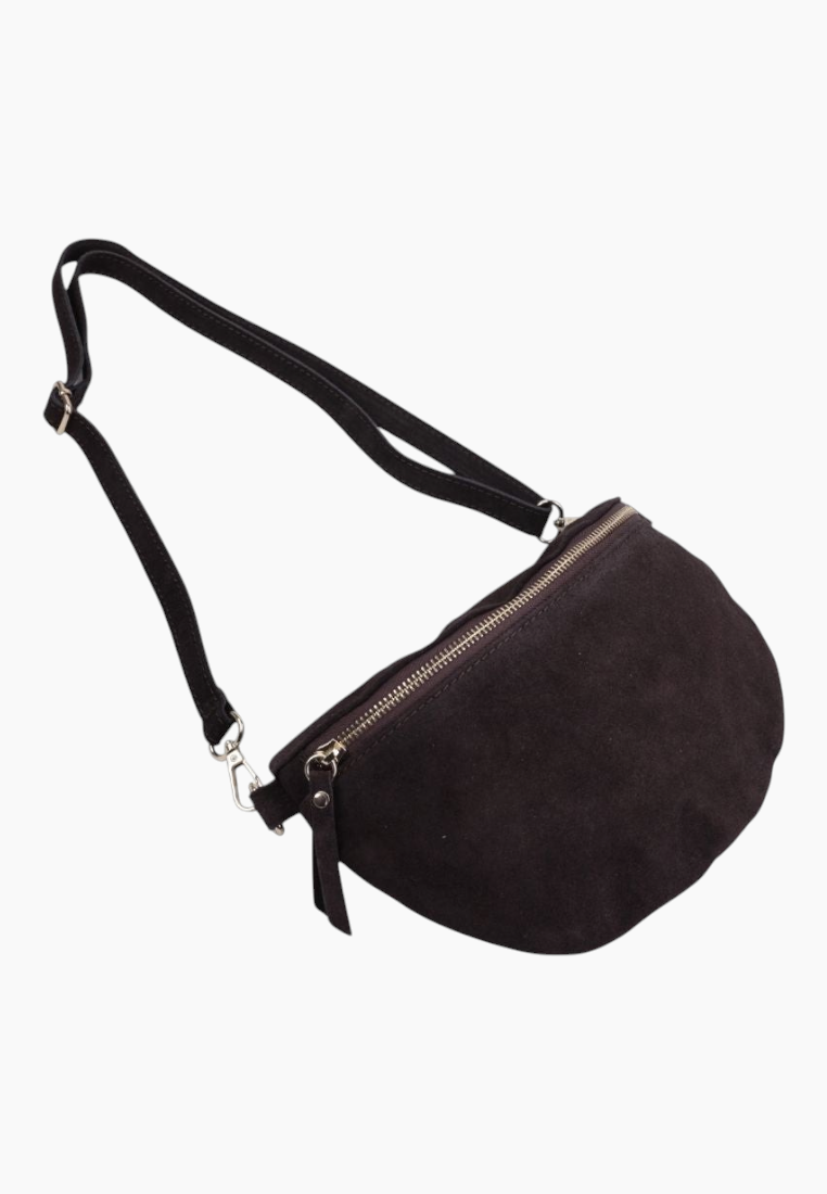 Side view of the black suede handbag with zipper closure and adjustable strap.
