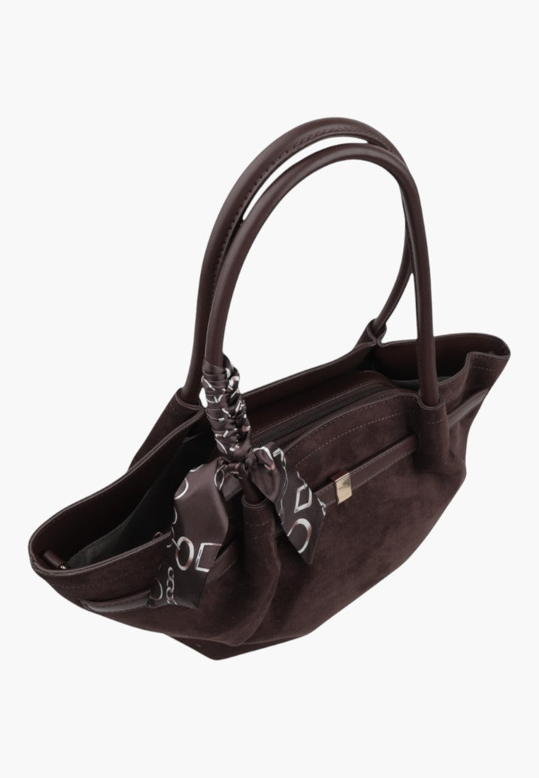 Side view of a brown faux leather shopper bag with shoulder straps and decorative scarf detail.