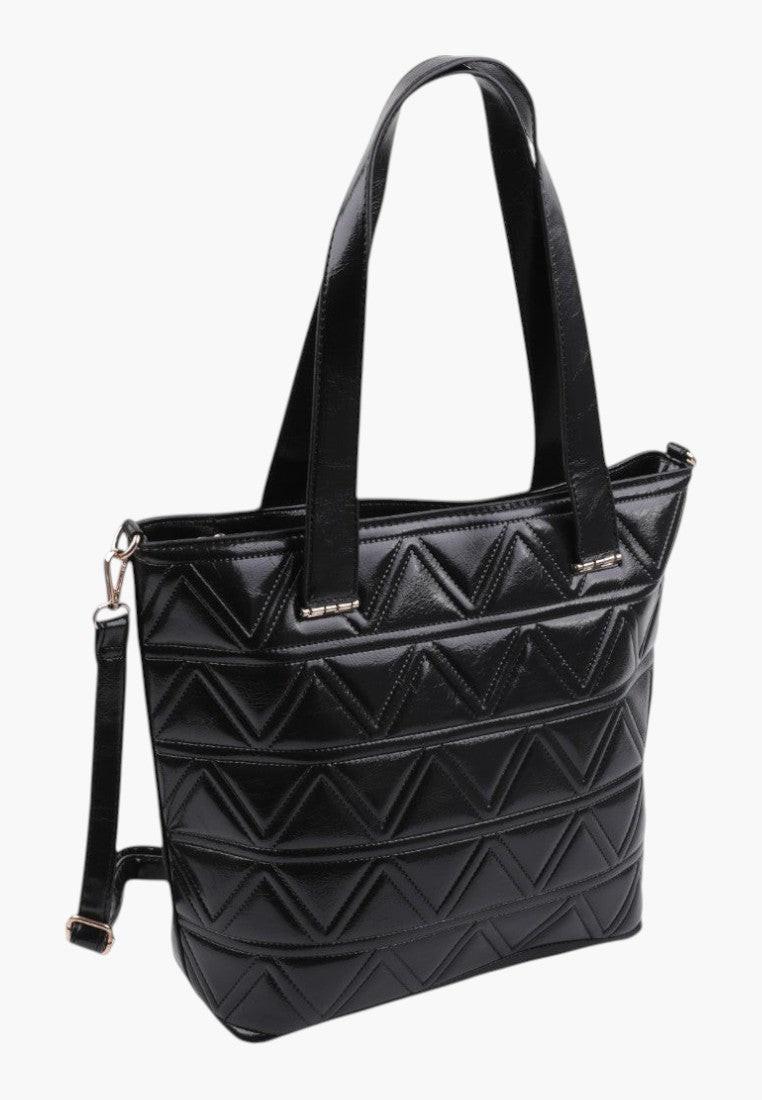 Tylny widok czarnej torebki shopper o gładkim wykończeniu i minimalistycznym designie.