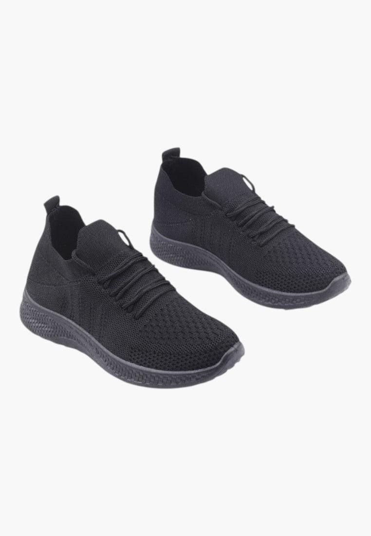 Front view of black athletic shoes with slip-on design on a white background