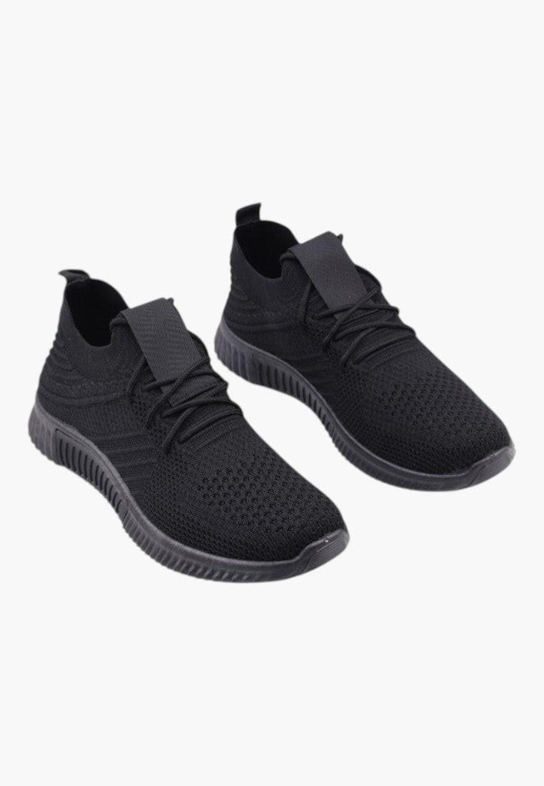 Czarne buty sportowe damskie z materiału tekstylnego, widok z boku.