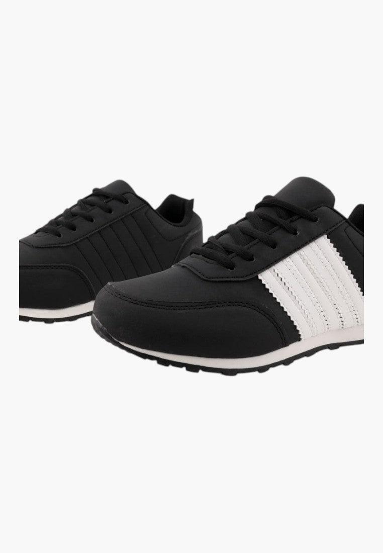Side view of black athletic shoes with a mesh upper and striped design
