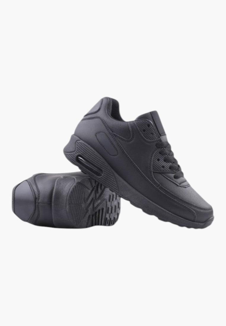 Czarne buty sportowe damskie, widok z boku, okrągły nosek, gruba podeszwa.