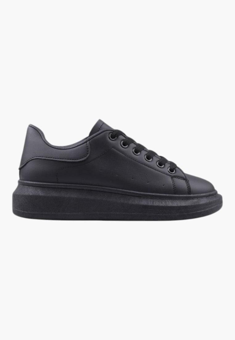 Side view of black women's sneakers featuring a low-top design and lace-up closure