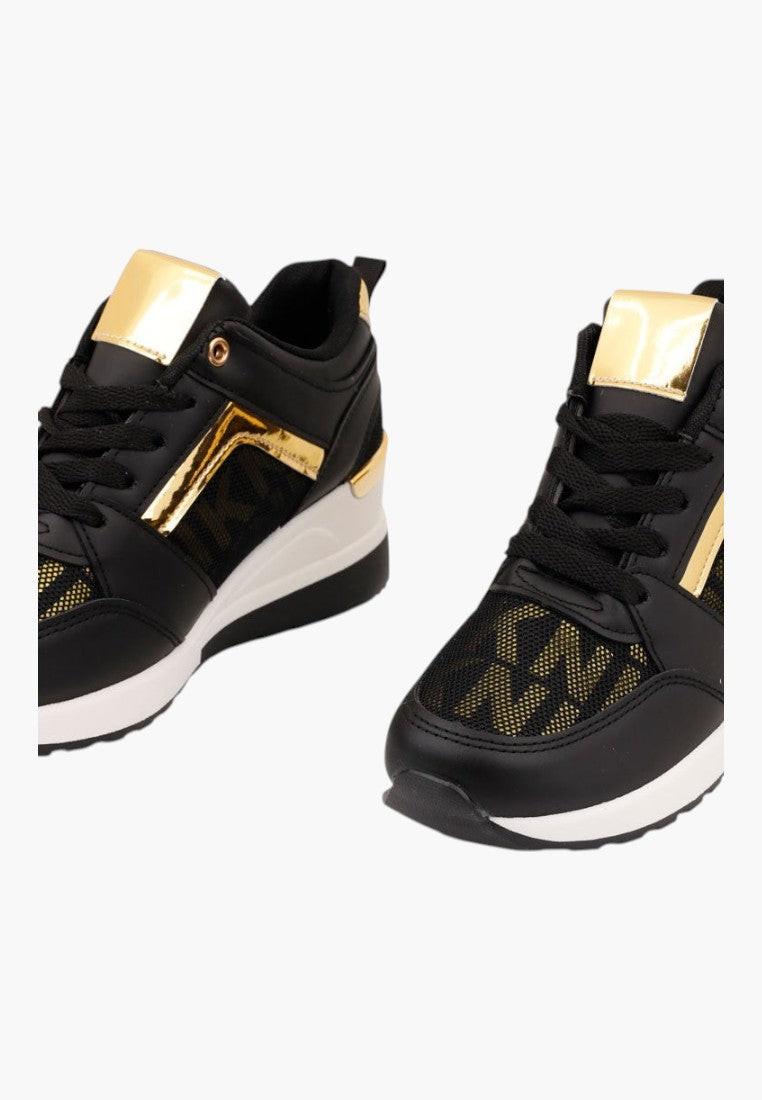 Czarno-złote sneakersy damskie, detal z teksturowanym materiałem.
