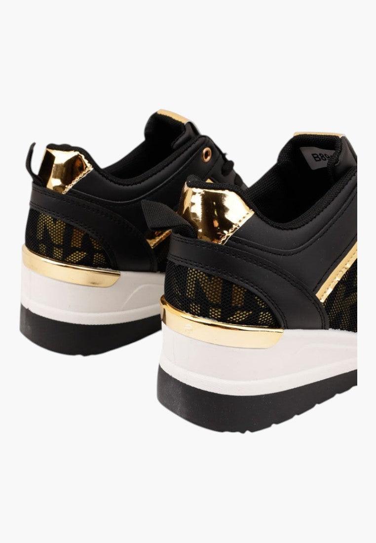 Czarno-złote sneakersy damskie, widok z tyłu, złote akcenty.