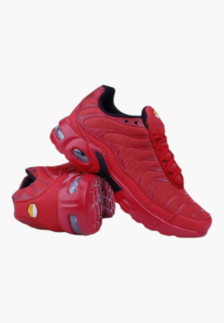 Czerwone damskie buty sportowe widok z boku na białym tle