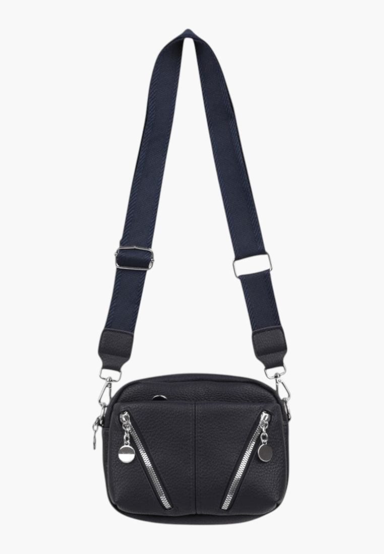 Lifestyle shot of a black crossbody bag worn by a model, highlighting its stylish design on a white background.