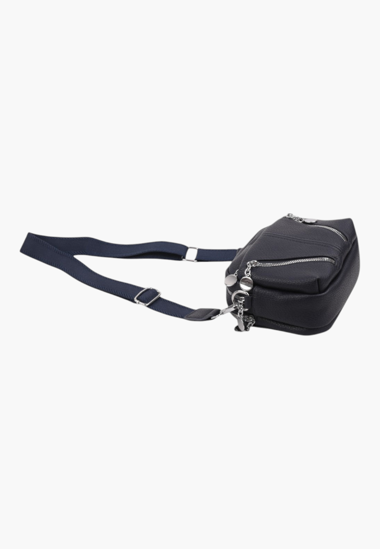 Side view of a navy crossbody bag featuring zipper closure on a white background.