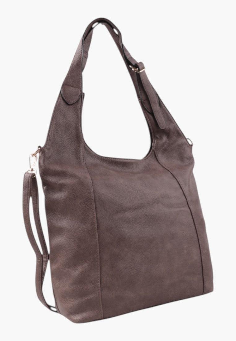 Boczny widok brązowej torebki damskiej shopper na ramię z miękkiego materiału.