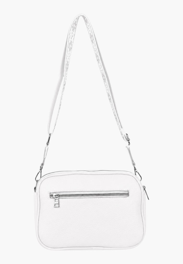 Back view of a white handbag with adjustable strap and logo detail.