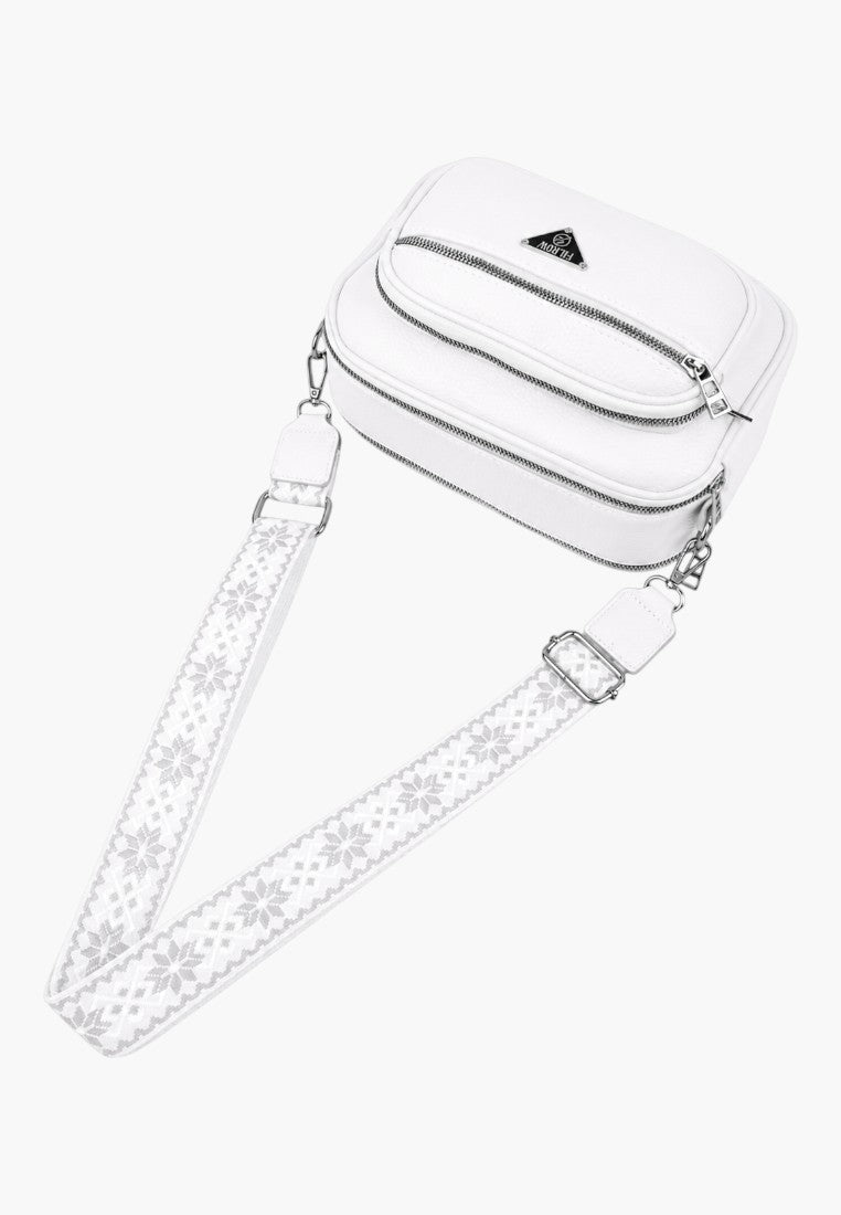 Detail close-up of a clear cosmetic bag with zipper closure and transparent material.