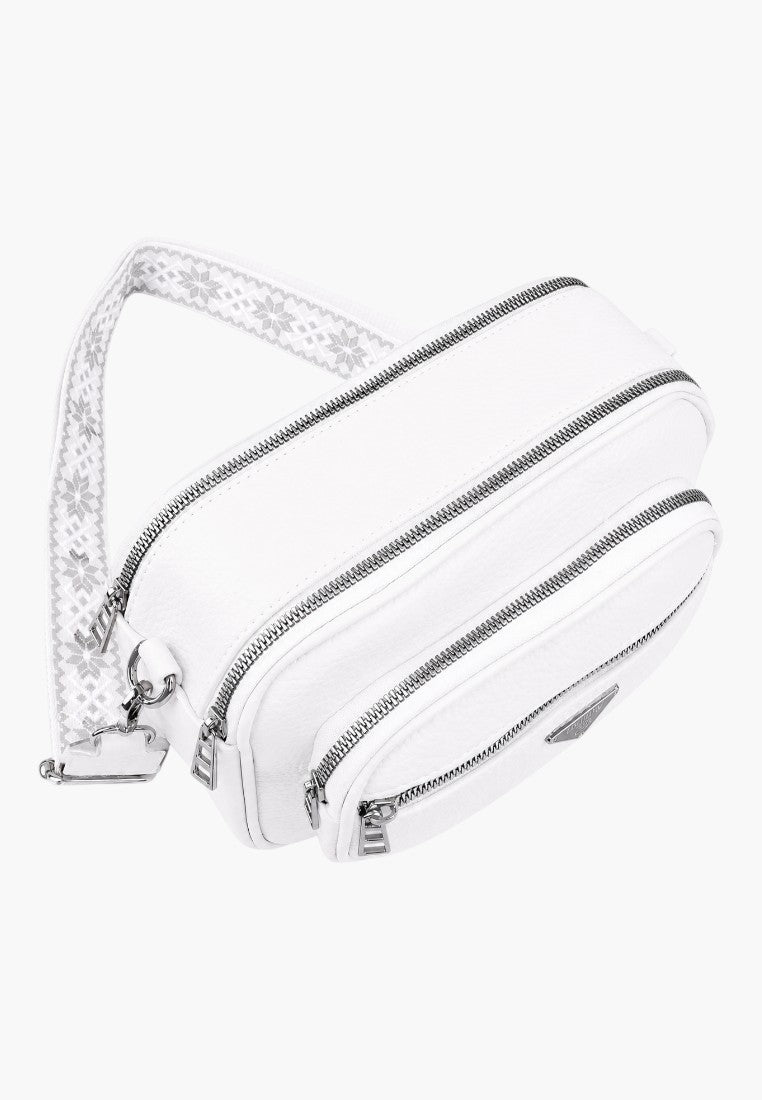 Front view of a striped cosmetic bag in white and black with double zipper.