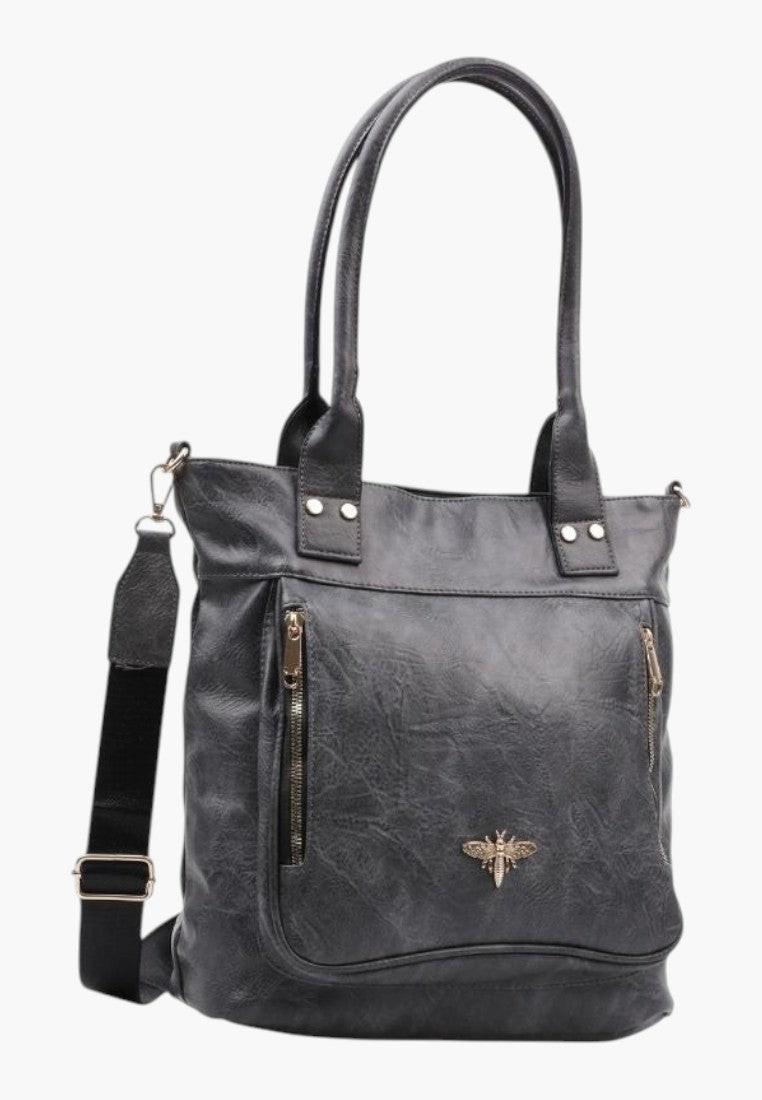 Boczny widok eleganckiej szarej torebki shopper na ramię z ekoskóry z zamkiem błyskawicznym.