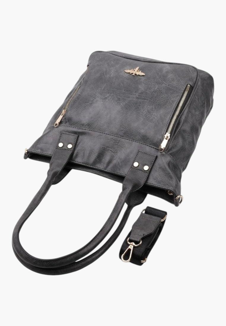 Szczegółowy widok eleganckiej szarej torebki shopper na ramię z ekoskóry z zamkiem błyskawicznym i złotymi akcentami.