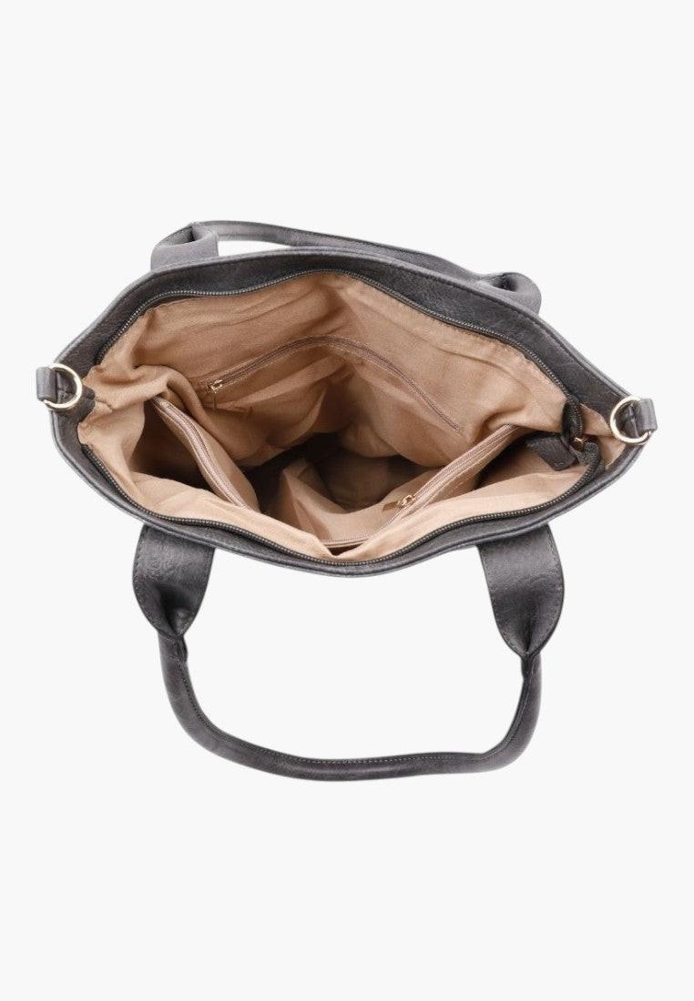 Szczegółowy widok wnętrza eleganckiej szarej torebki shopper na ramię z ekoskóry w kolorze beżowym.