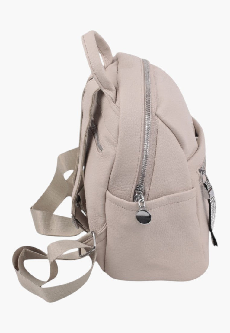 Falio beige faux leather urban backpack with side view, featuring silver zippers and adjustable straps