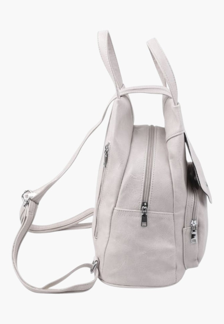 Falio beige faux leather urban backpack with side view, zipper pockets, and adjustable straps for A4 documents