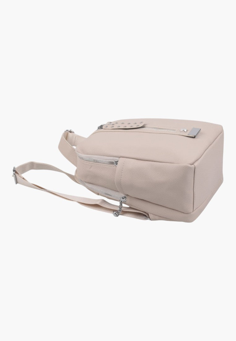 Falio beige faux leather urban backpack with silver zipper details and stud accents, side view.