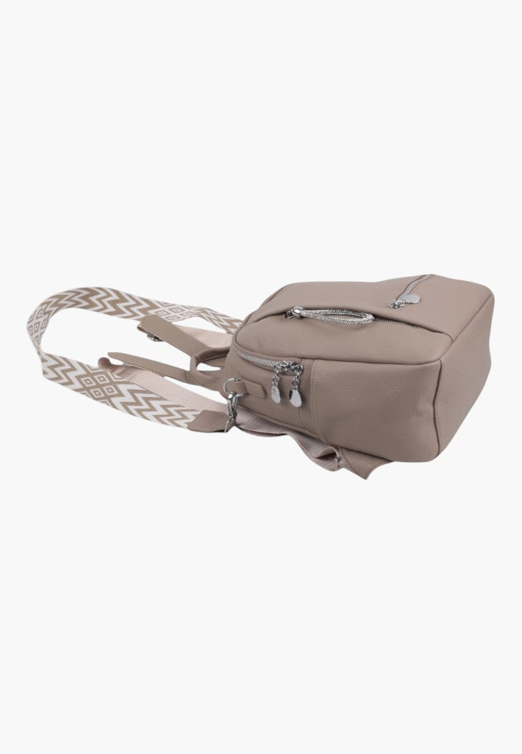 Falio beige faux leather urban backpack with patterned straps and silver zipper details, side view