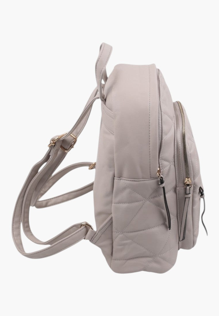 Falio beige faux leather urban backpack with quilted pattern, side view showing adjustable straps and zipper pockets.