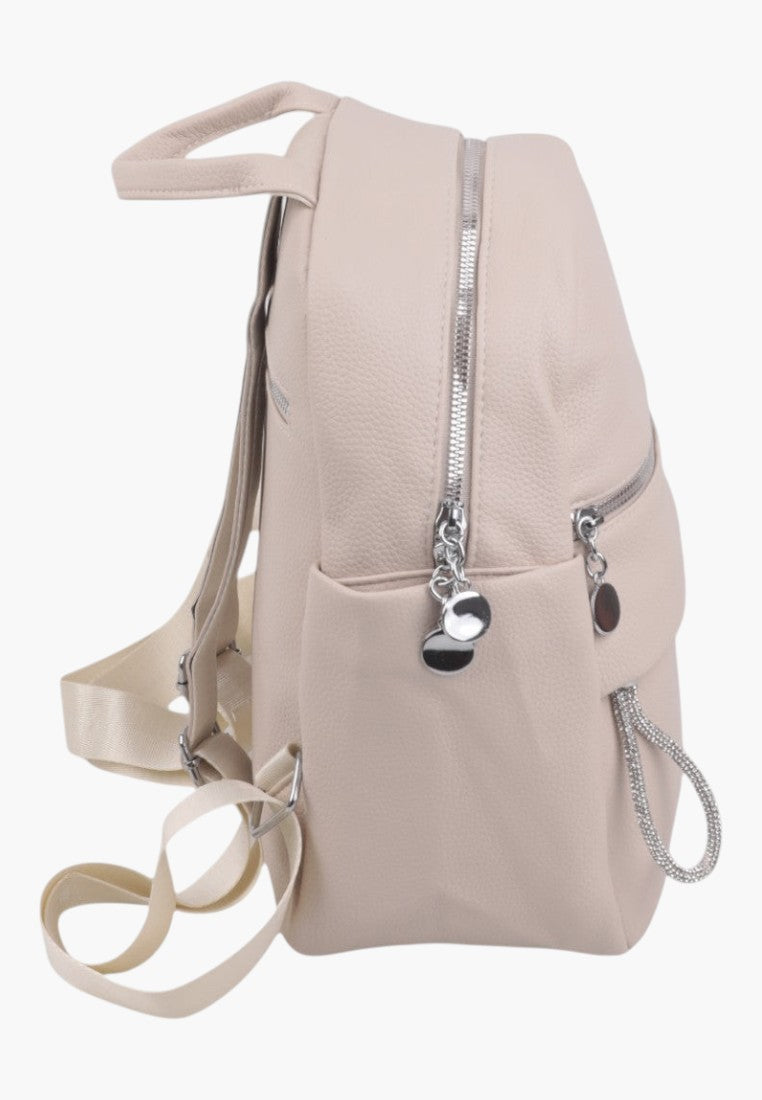 Falio beige faux leather urban backpack with silver zippers and adjustable straps, side view