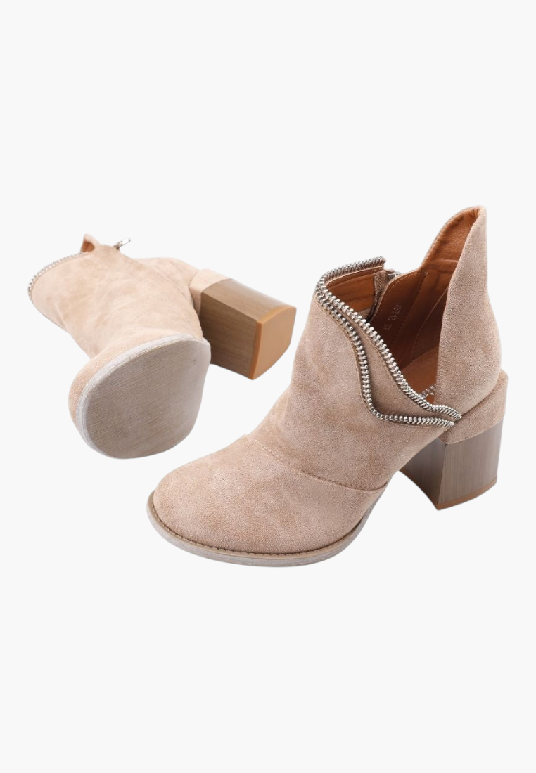 Falio beige faux suede ankle boots with side cutouts, zipper detail, and a wide wooden-look block heel.