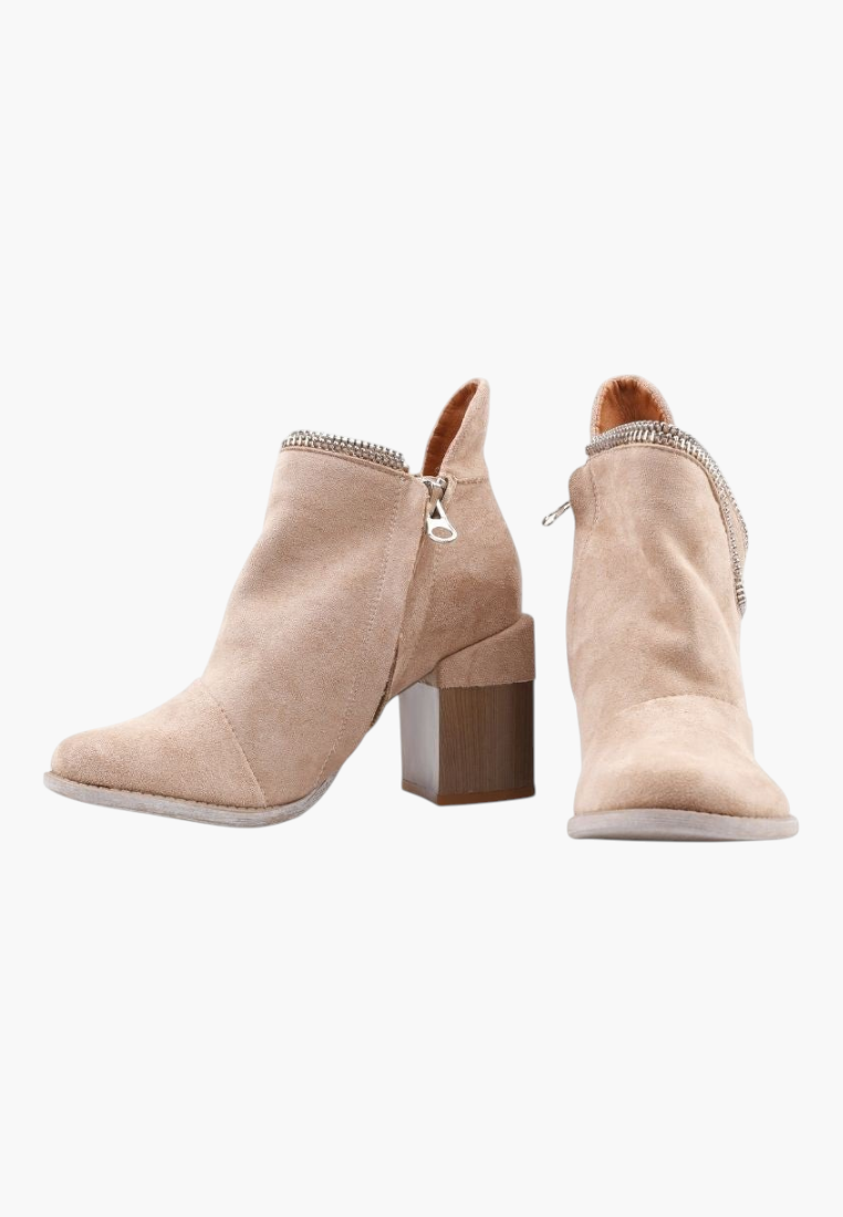 Falio beige faux suede ankle boots with a wide block heel, side cutout, and zipper closure, perfect for boho style.