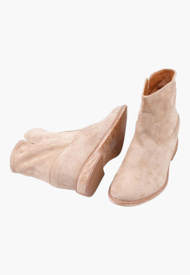 Falio beige faux suede ankle boots with a hidden wedge heel and western-inspired design, lightly insulated.