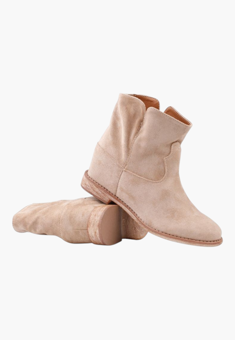 Falio beige faux suede ankle boots with a hidden wedge heel and rounded collar for a western-inspired look.