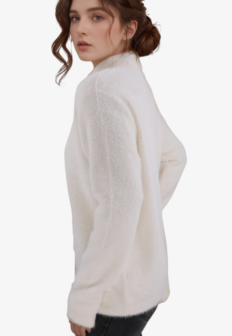 Falio beige mock neck sweater made of a soft wool and cashmere blend, worn by a woman in a side profile view.