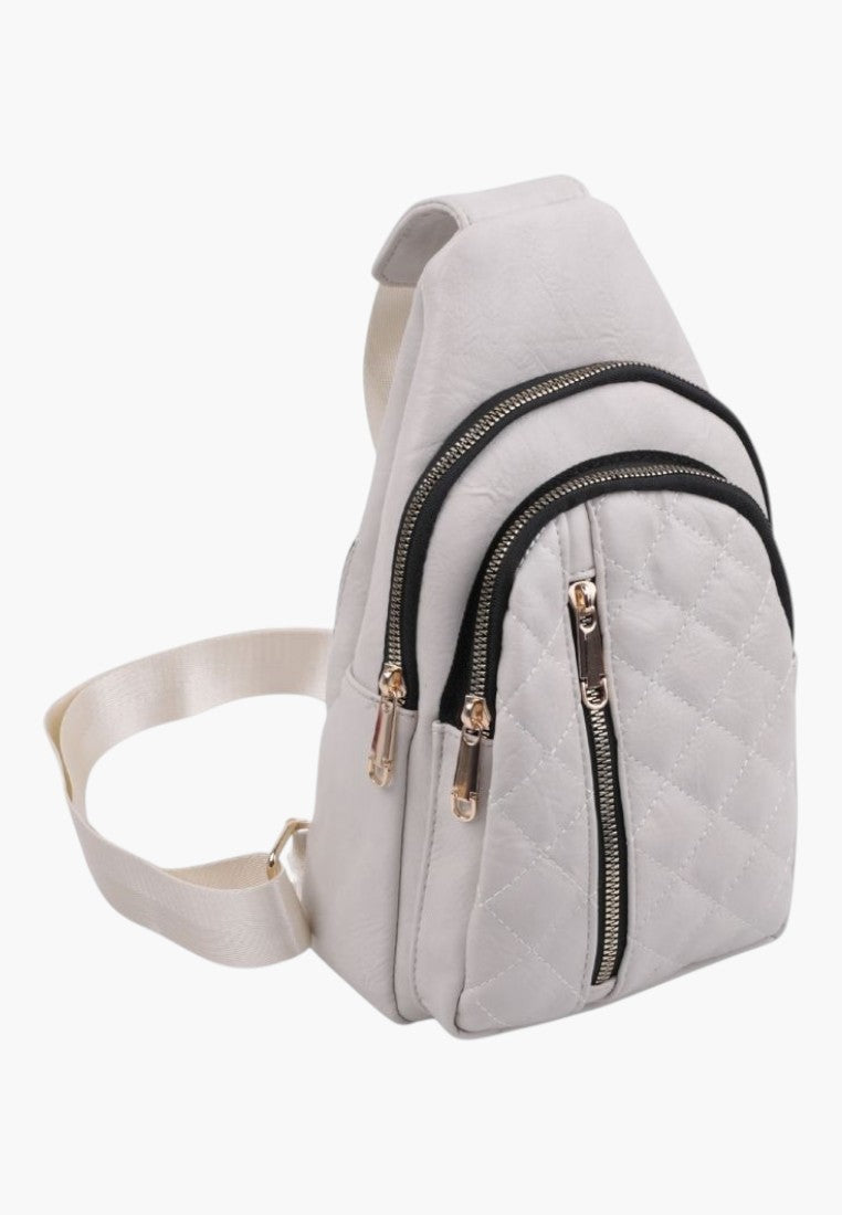 Falio beige quilted faux leather urban sling backpack with multiple zippered pockets and adjustable strap