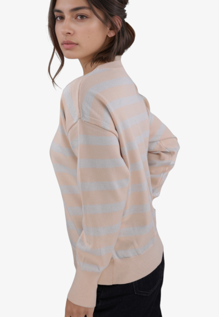 Falio beige and silver striped pullover sweater with round neckline and long sleeves worn by a woman