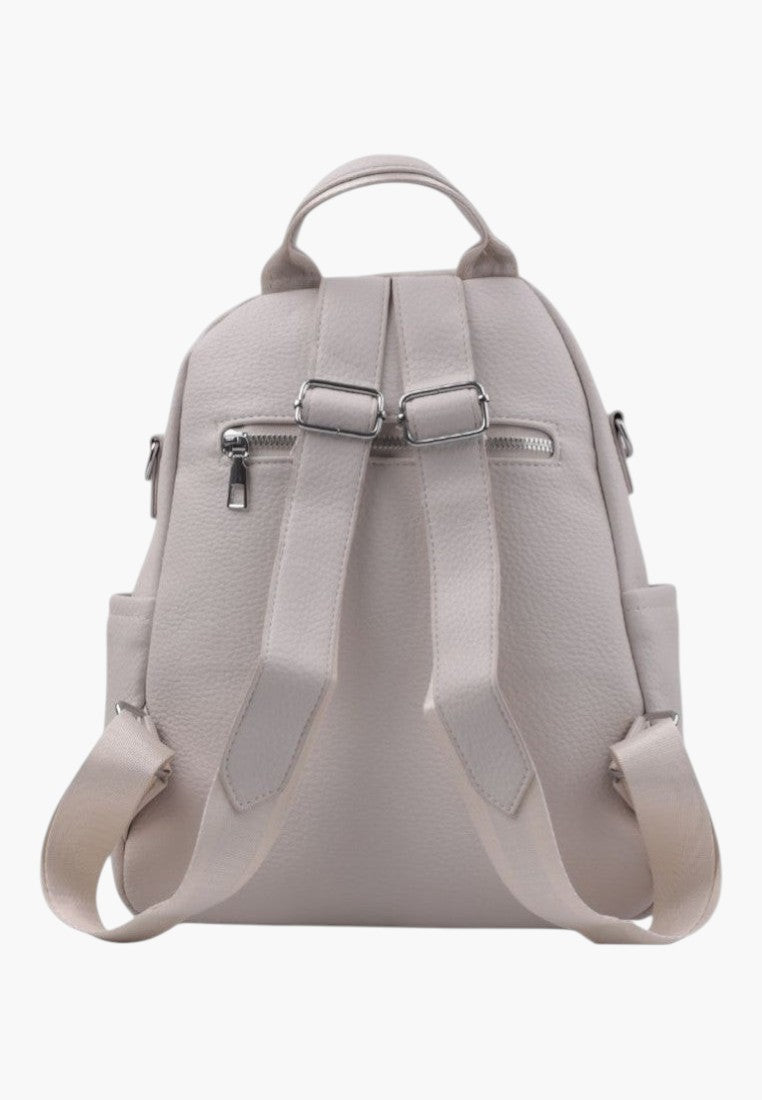 Falio beige urban women's backpack with adjustable straps and back zipper pocket, viewed from the back.