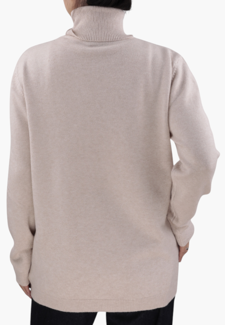 Falio beige viscose turtleneck sweater worn by a woman, back view showing long sleeves and ribbed collar detail.