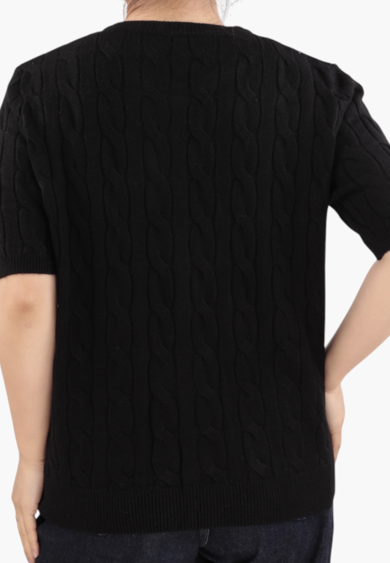 Falio black short-sleeve cable knit sweater with a round neckline worn by a woman, back view