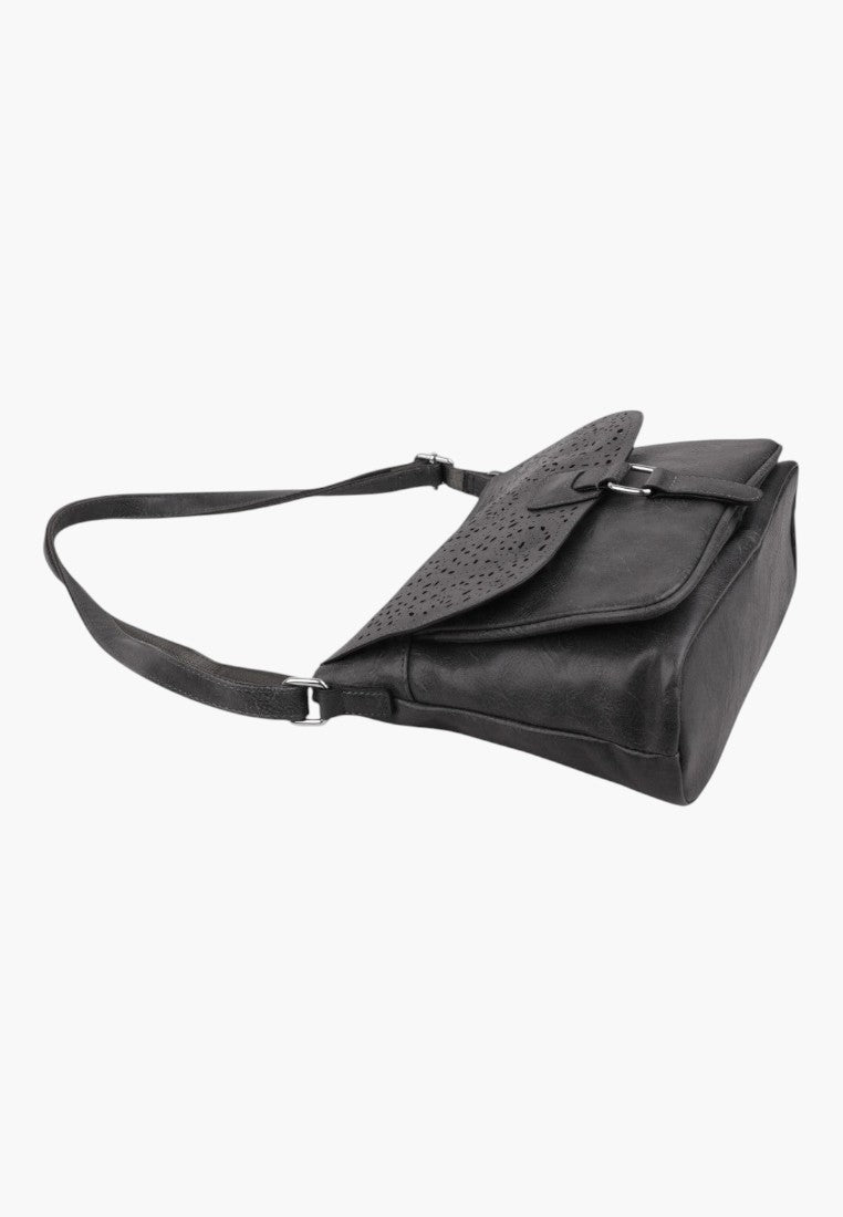Falio black crossbody bag with a laser-cut floral pattern on the flap and an adjustable shoulder strap