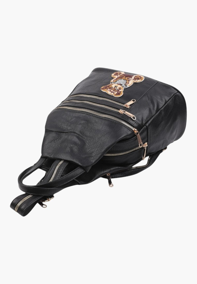 Falio small black faux leather city backpack with multiple zippered pockets and a decorative bear patch