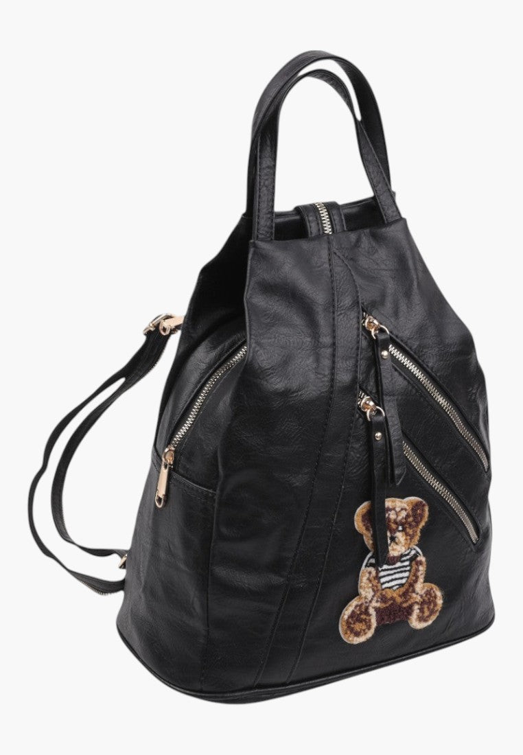 Falio black faux leather urban backpack with multiple zippered pockets and a cute teddy bear patch