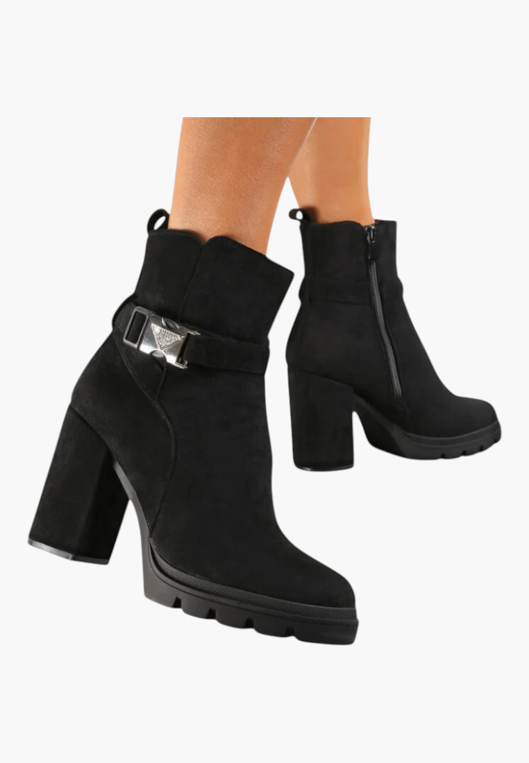 Falio black faux leather ankle boots with a chunky block heel, side zipper, and decorative buckle strap detail.