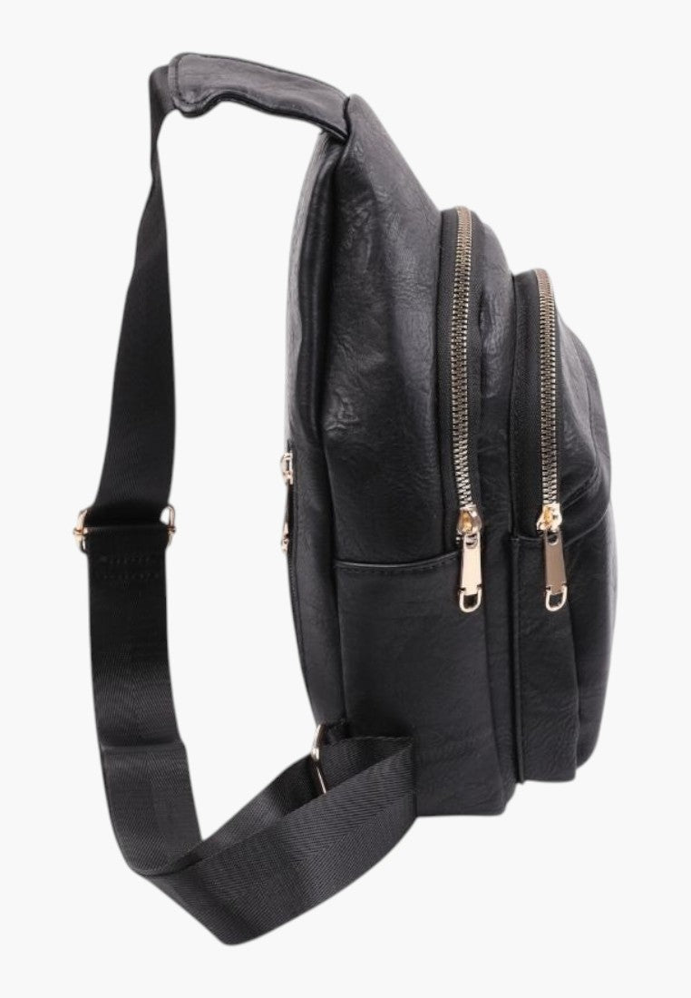 Falio black faux leather urban sling backpack with multiple zippered compartments and adjustable shoulder strap