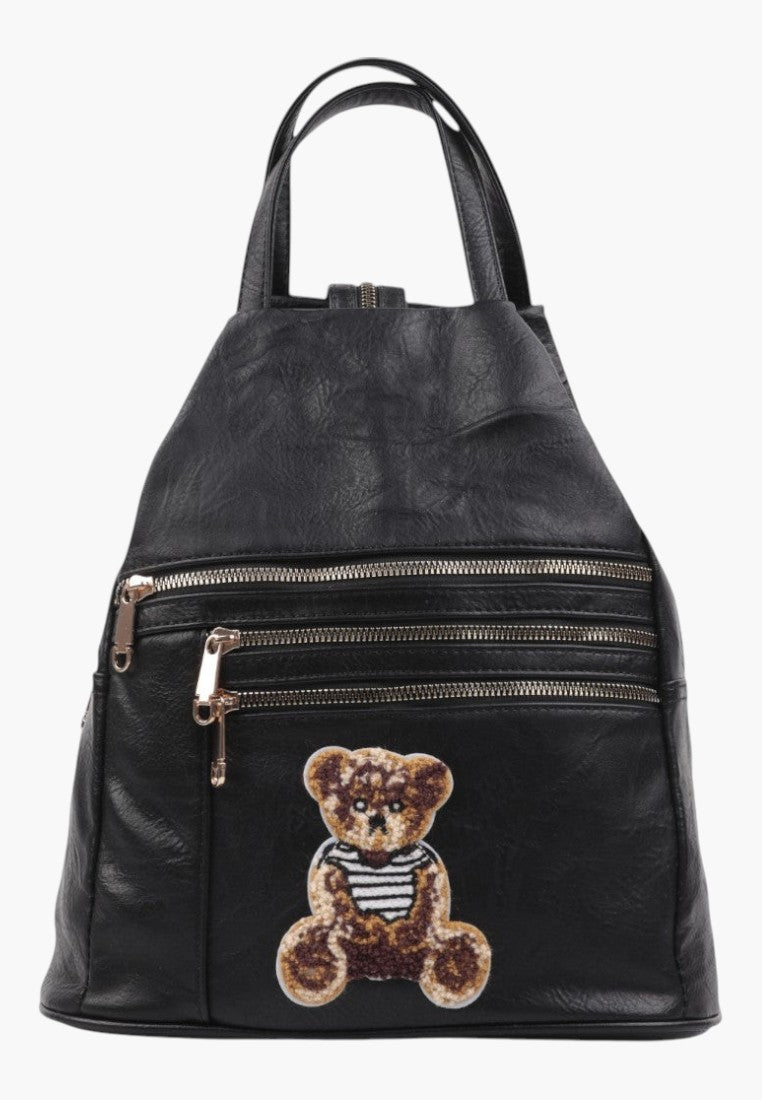 Falio small black faux leather city backpack for women with a cute teddy bear patch and multiple zippered pockets.
