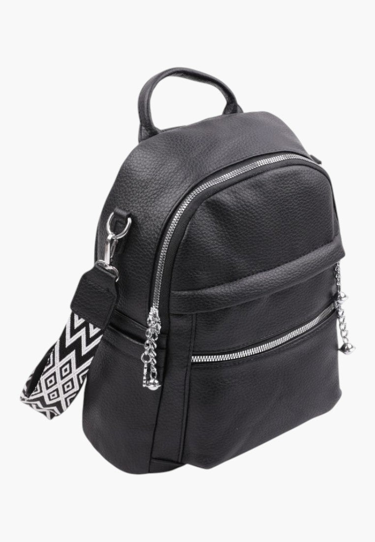 Falio women's black faux leather urban backpack with silver zippers and a patterned geometric shoulder strap