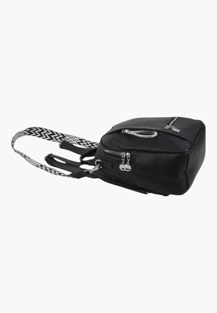 Falio black faux leather urban backpack with patterned straps and silver zippers, side view
