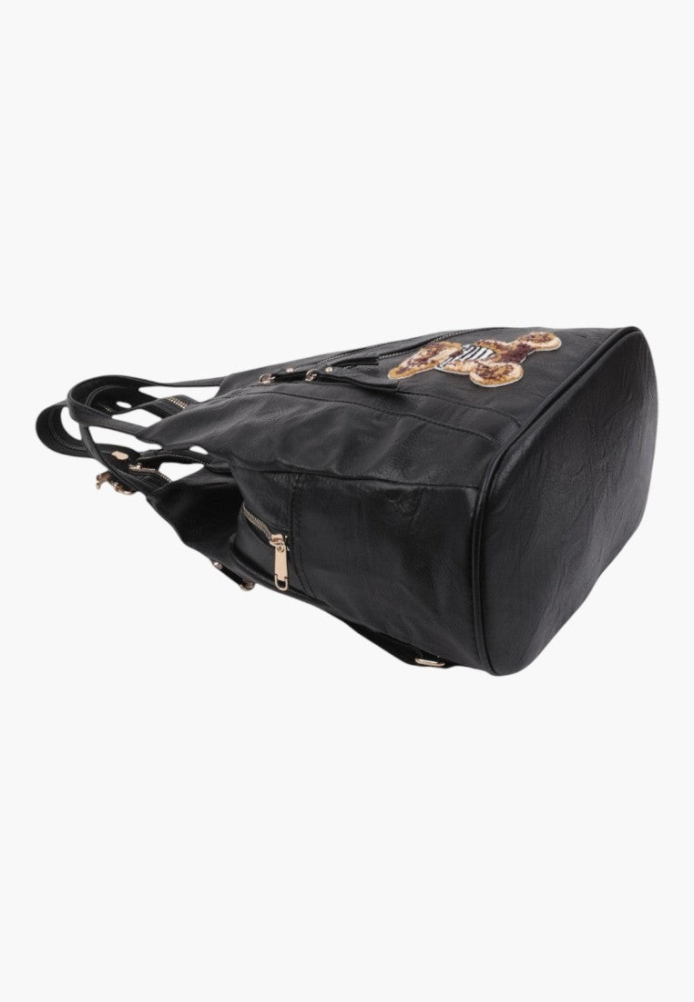 Falio black faux leather urban backpack with a decorative patch and multiple zippered pockets