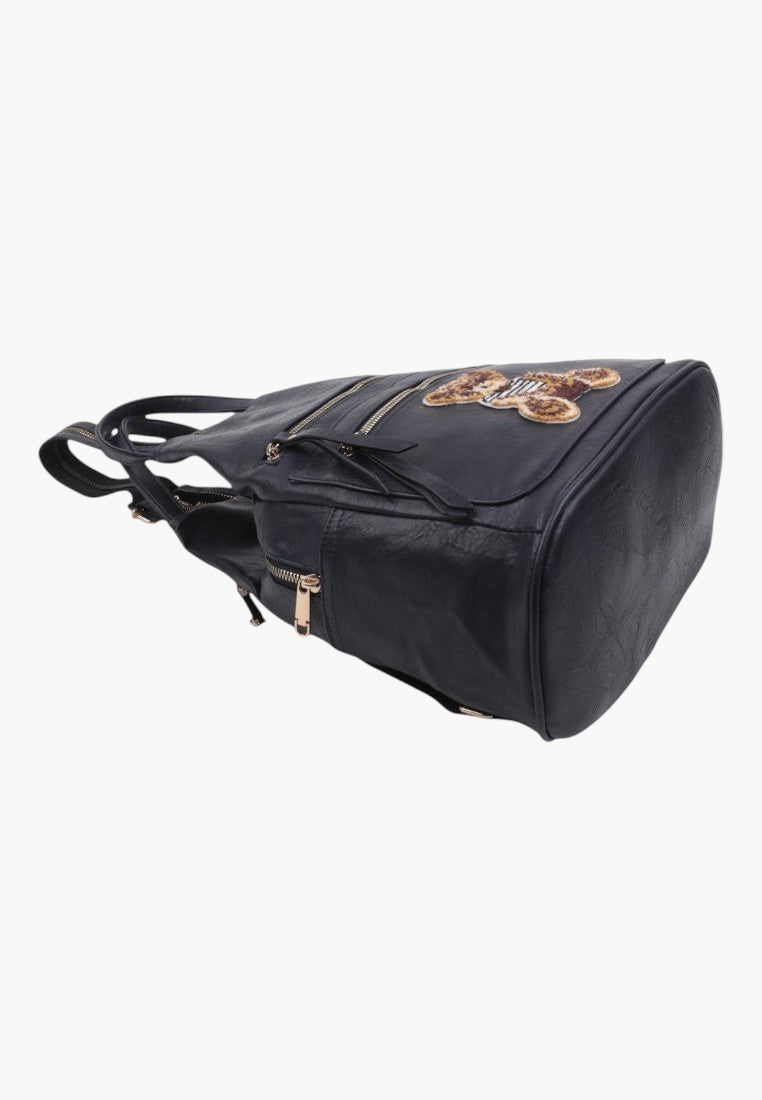 Falio black urban faux leather backpack with a decorative bear patch and multiple zippered pockets
