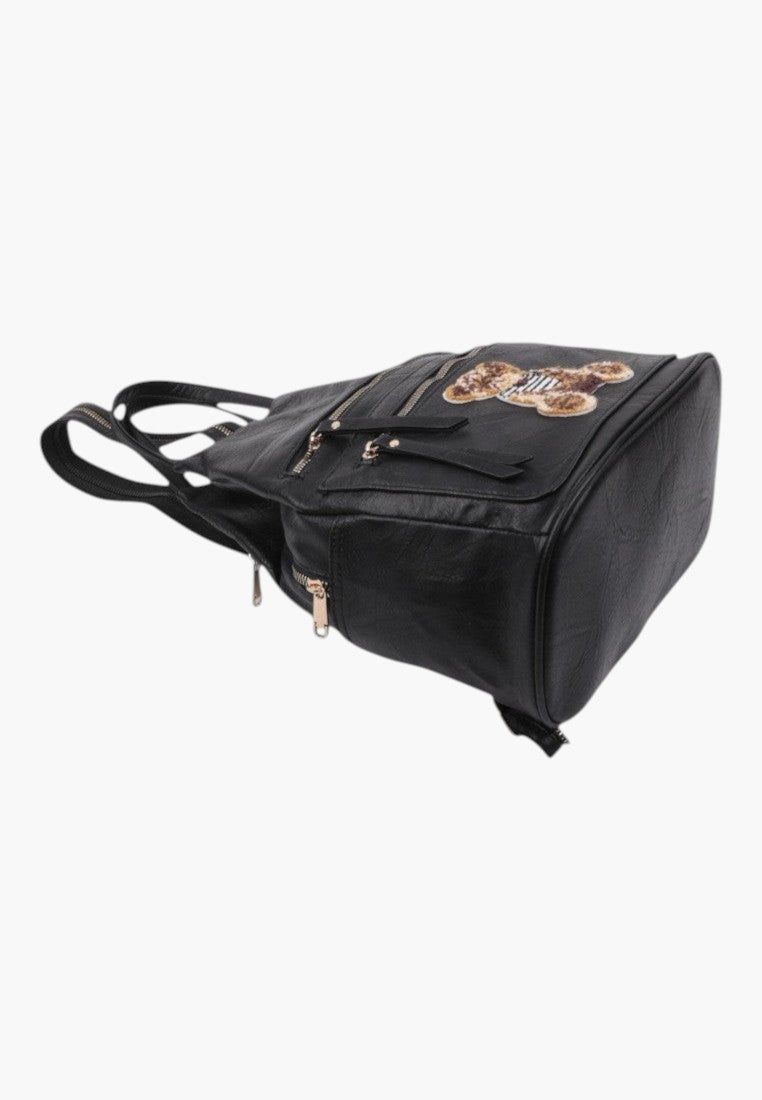 Falio black faux leather urban backpack with a decorative bear patch and multiple zippered pockets